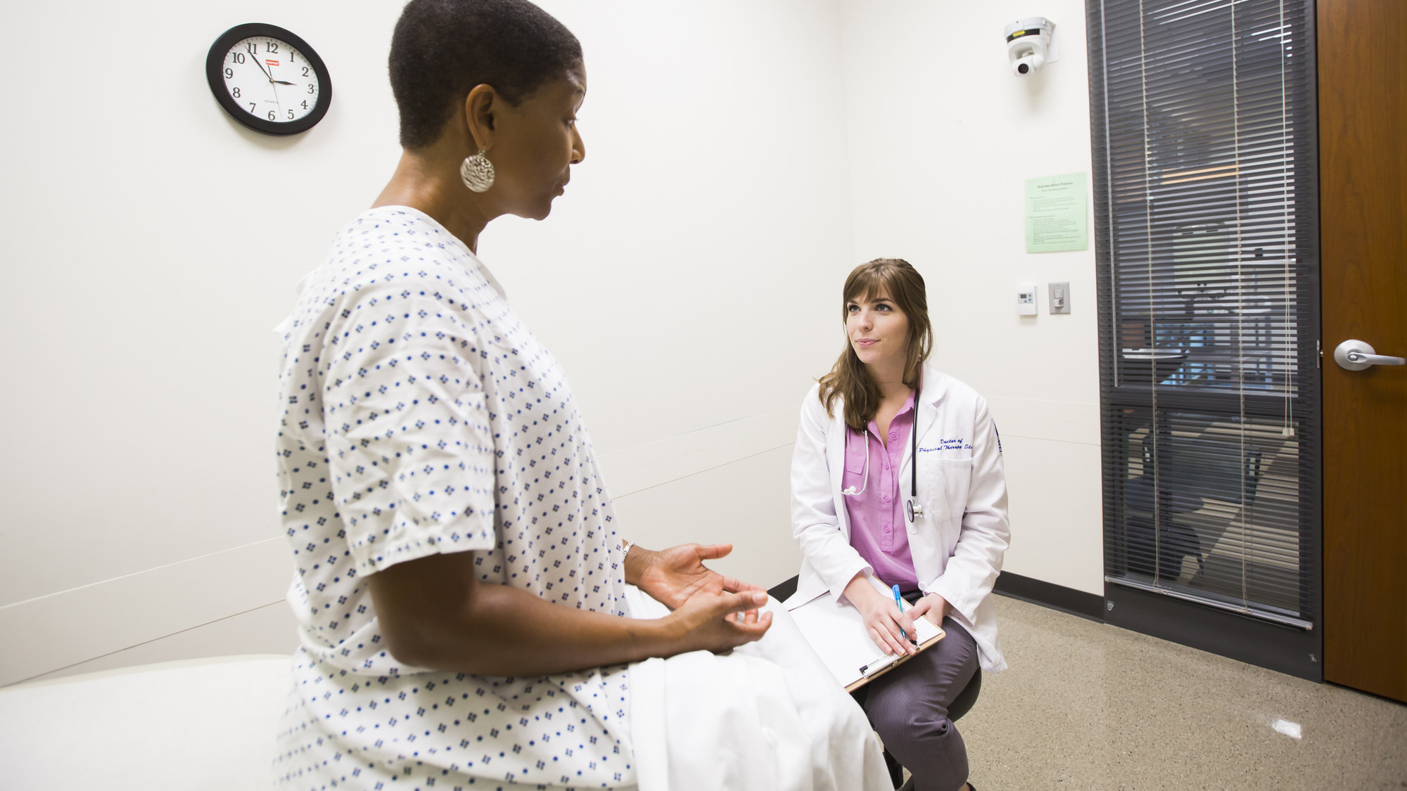 Student talking to patient