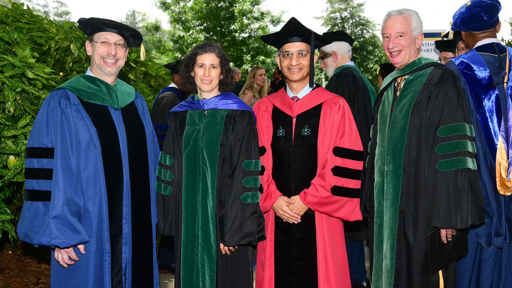 Dean and leadership in cap and gown