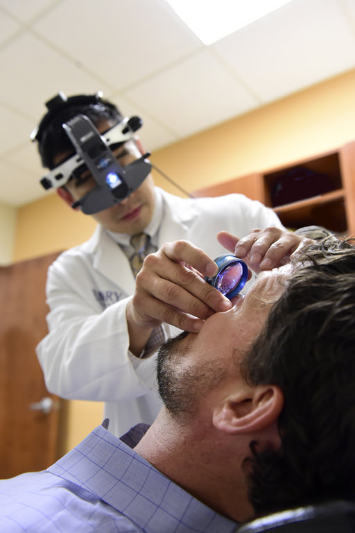 Doctor performing eye examine
